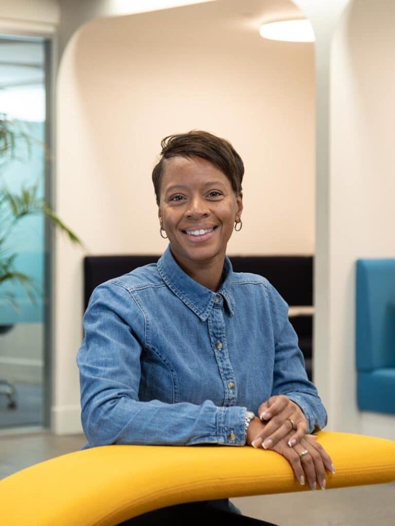 Woman sat at yellow desk