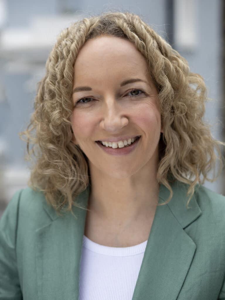 Woman wearing green suit jacket